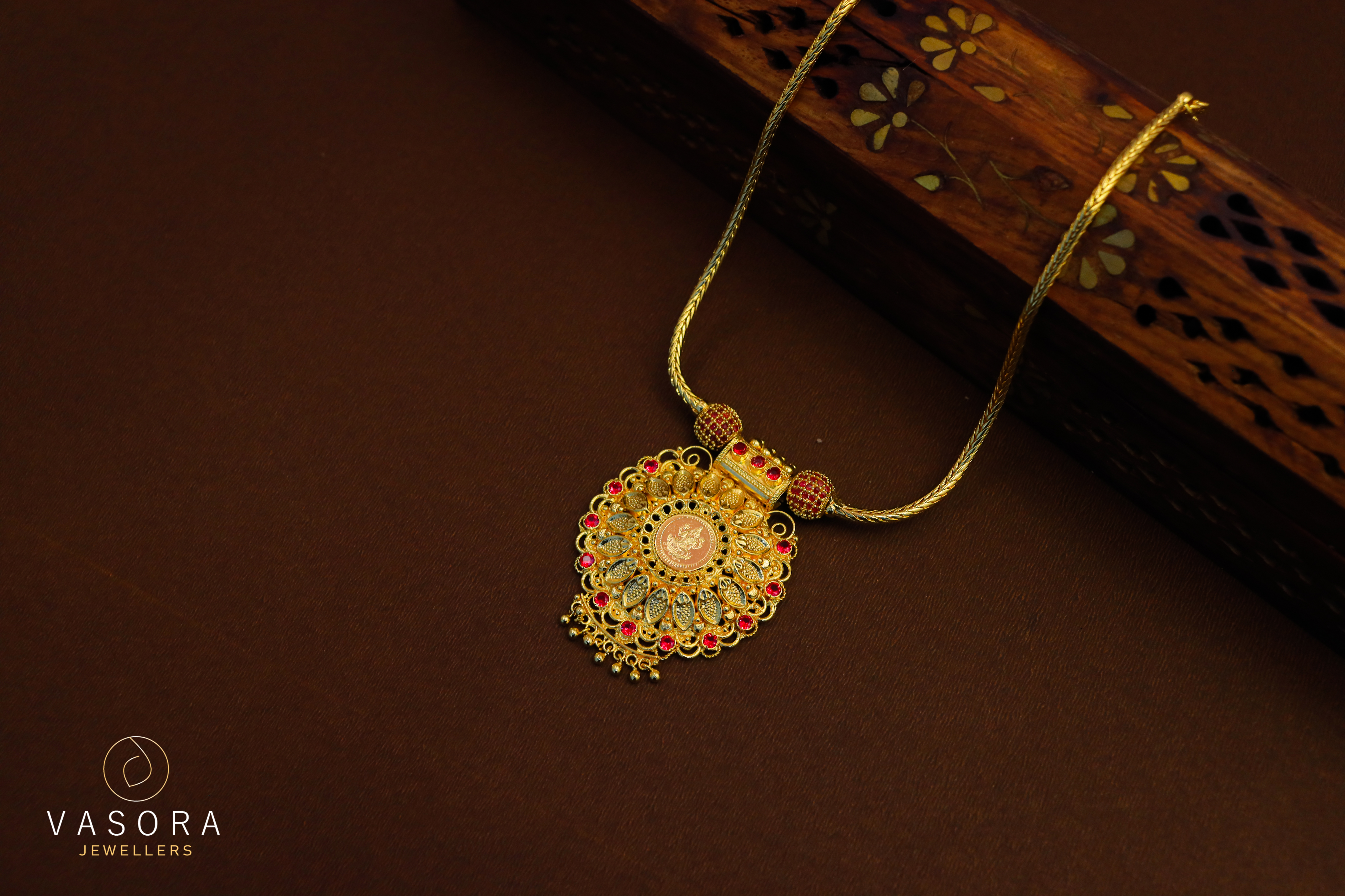 Gold Plated Lakshmi Temple Pendant Necklace with Red Stone Accents