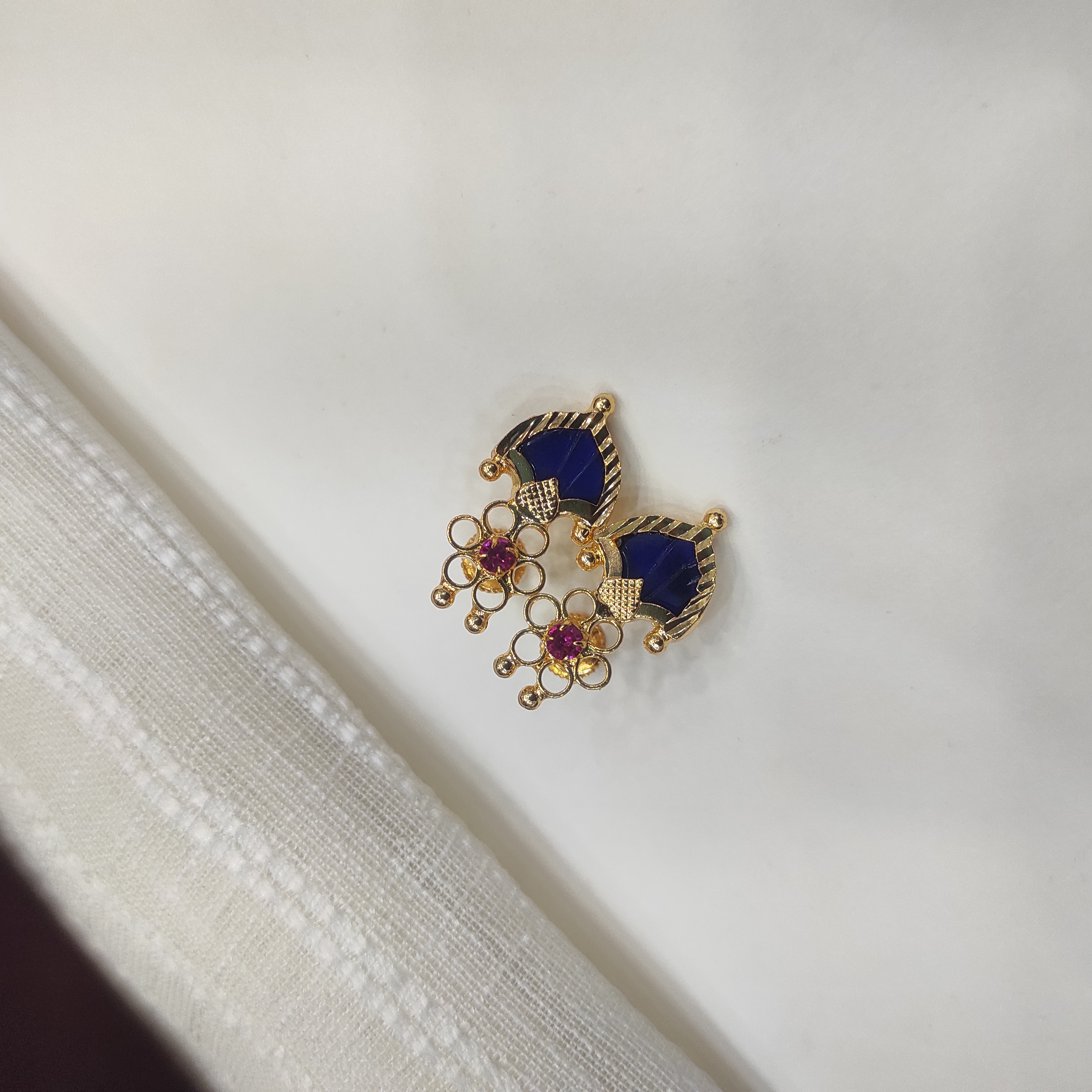 Gold plated Palakka flower blue stud