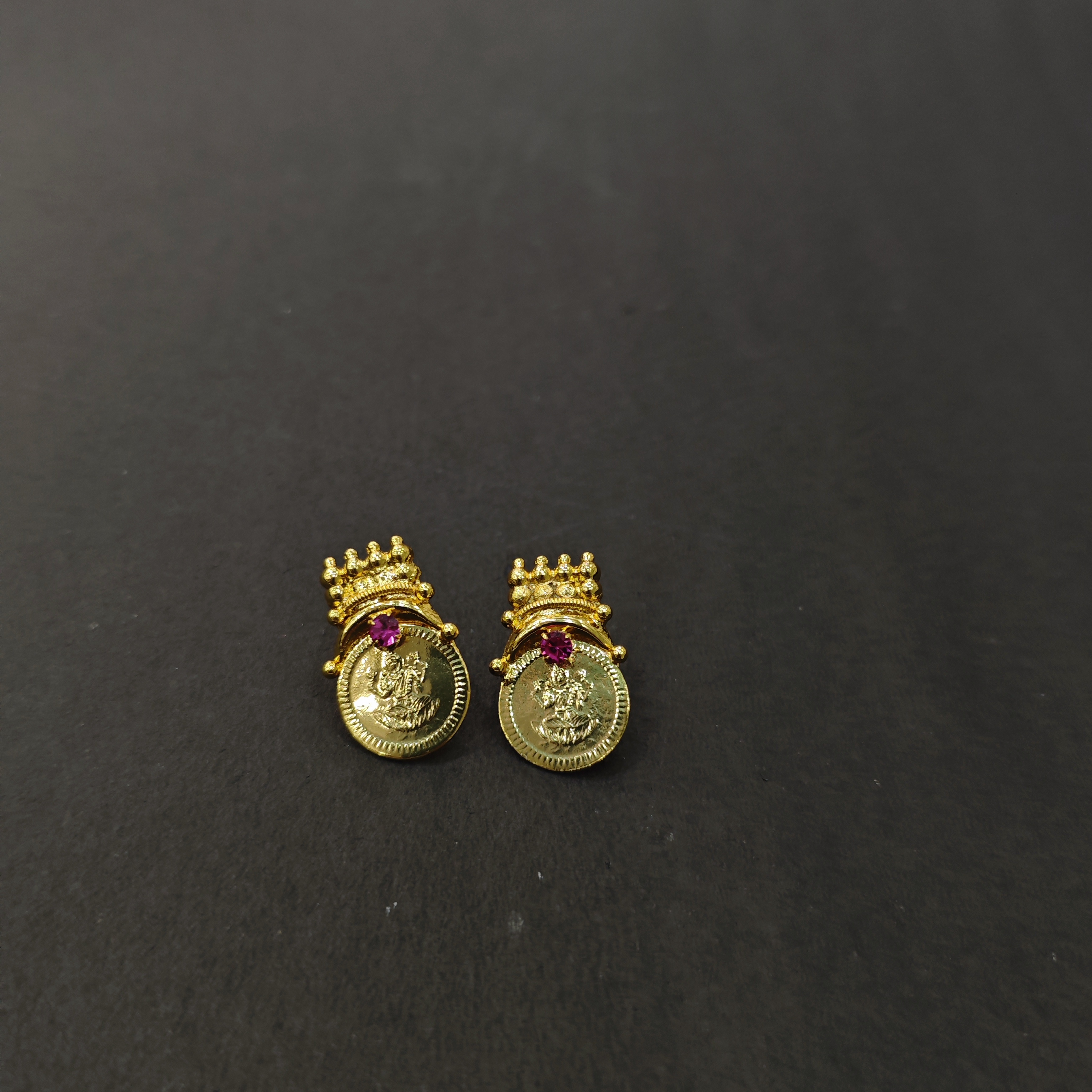 Gold plated lakshmi stud with ruby stone