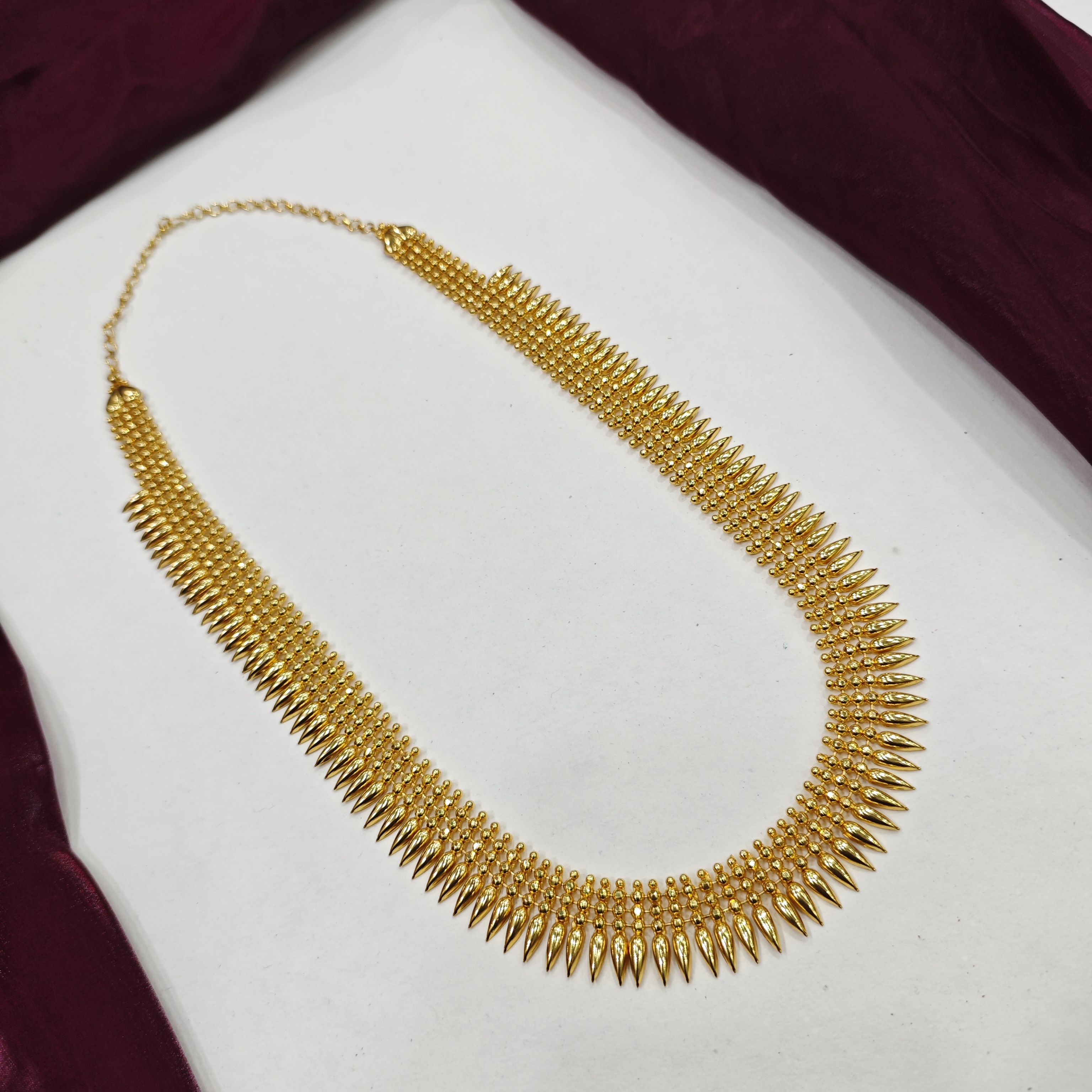 Gold plated mullamottu long