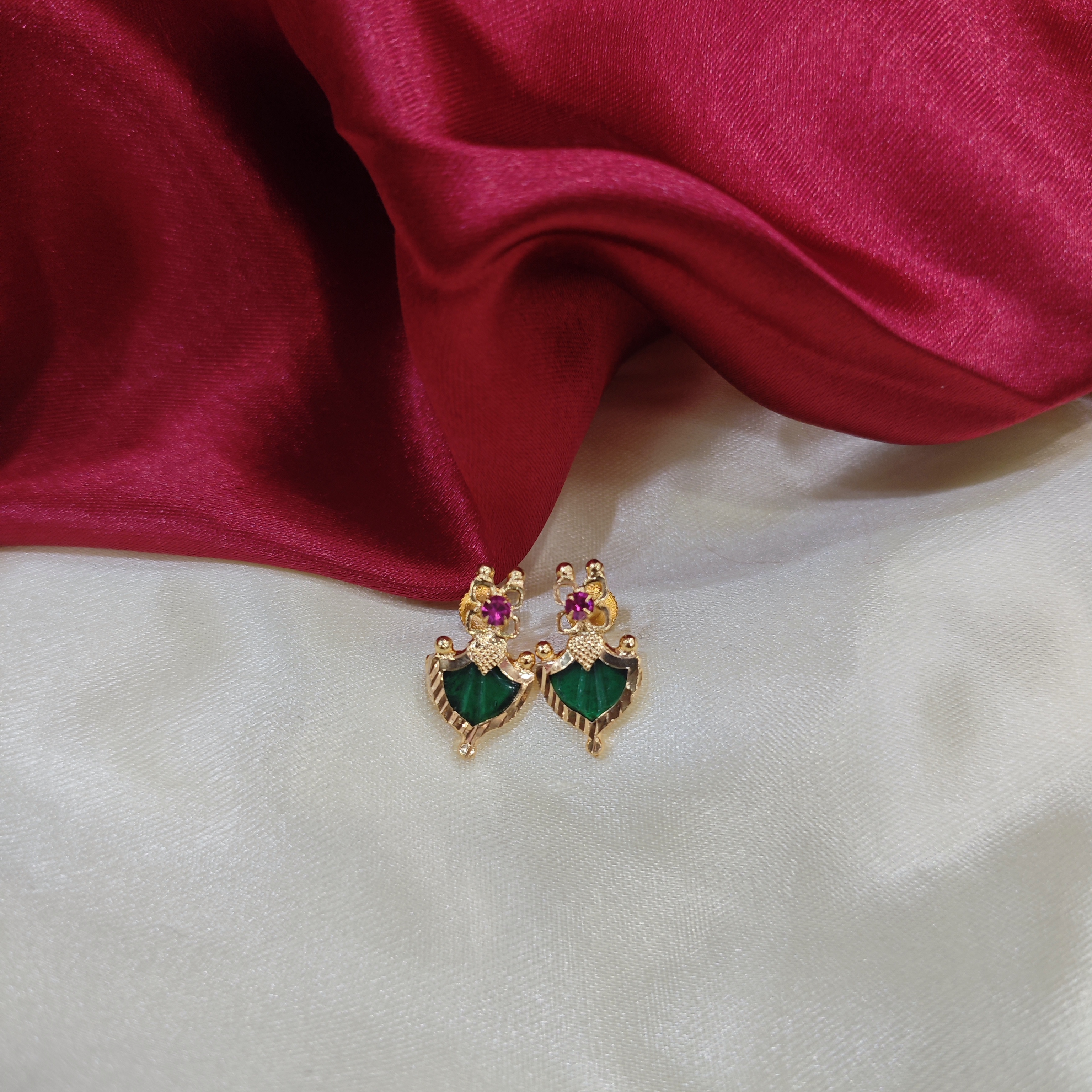 Gold plated palakka green stud with ruby stone 