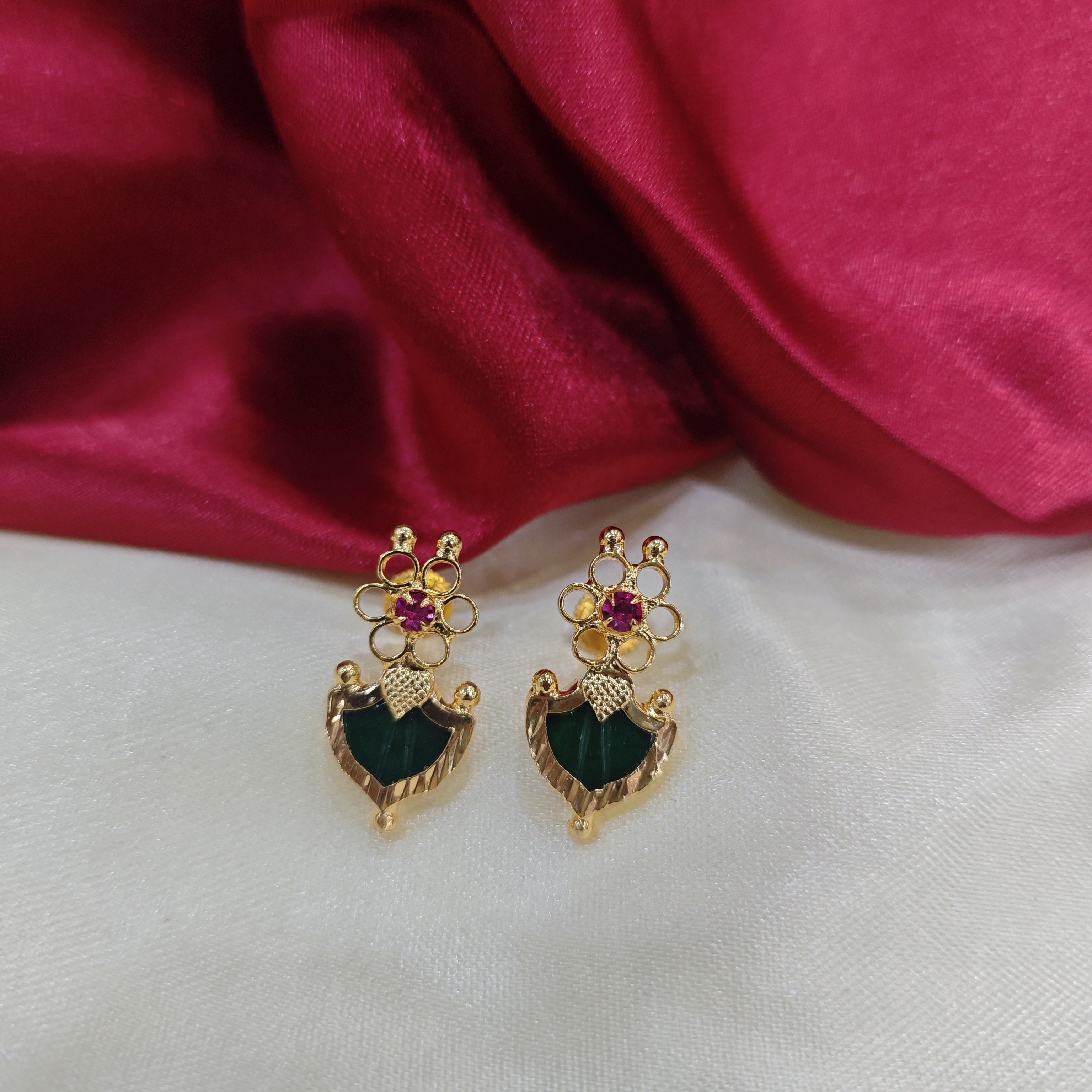 Gold plated flower green palakka stud with ruby stone