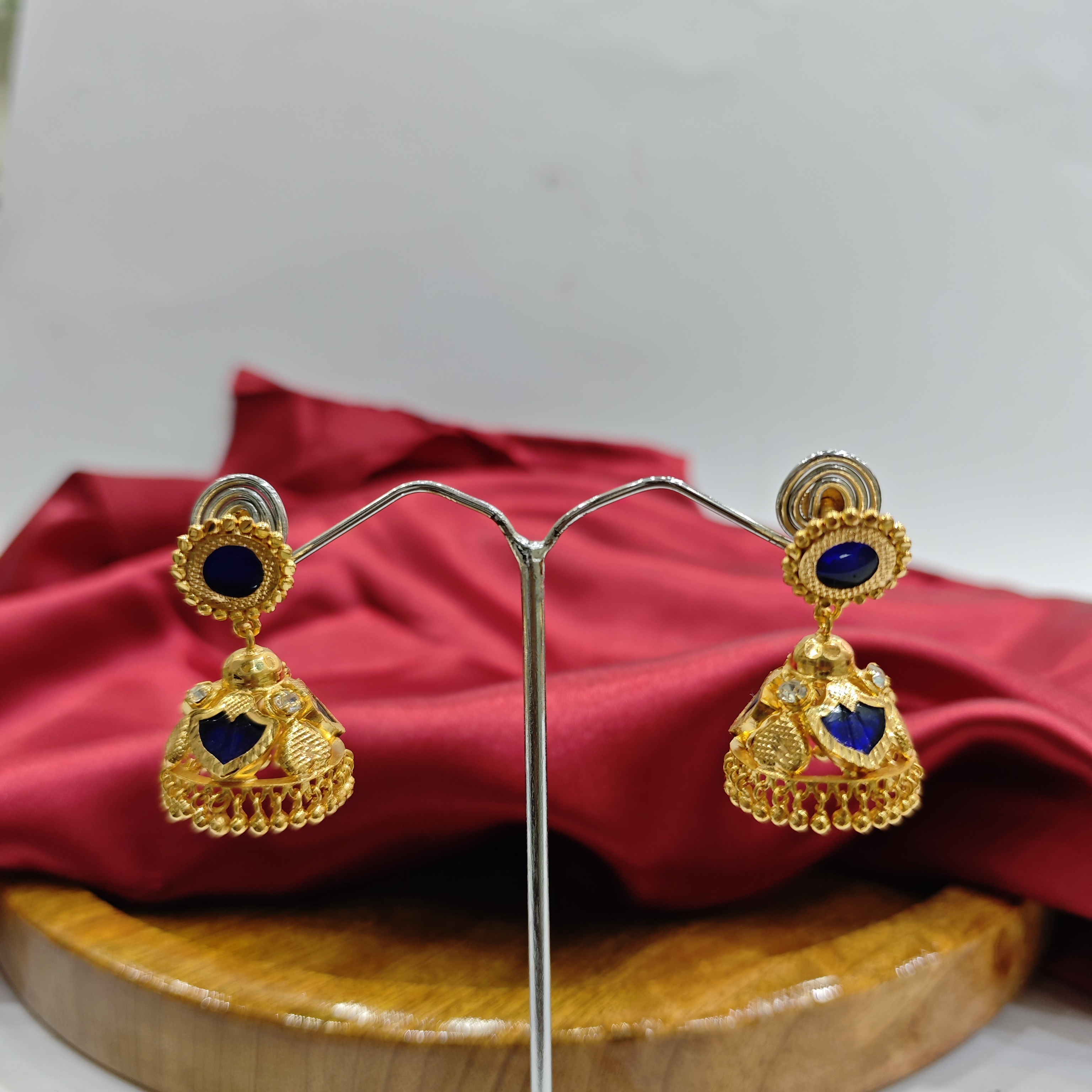 Vasora Gold Plated Palakka blue 3 Petals Jhumka Earrings